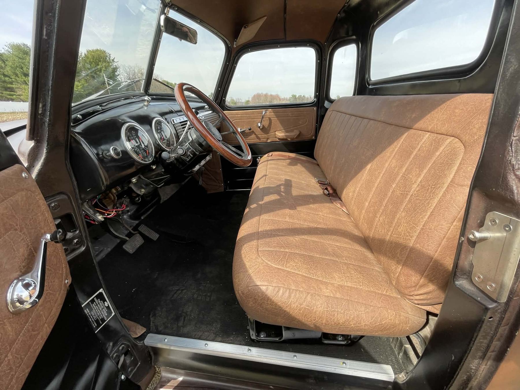 Brown bench seat and vintage truck dashboard